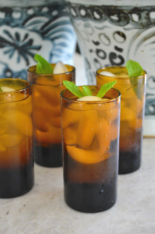 Amber glassware, amber glasses, colorful glassware, kitchenware, fun glasses, bar decor, home decor, eclectic home, amber decor, handblown glass, handmade glassware, home goods, full view.