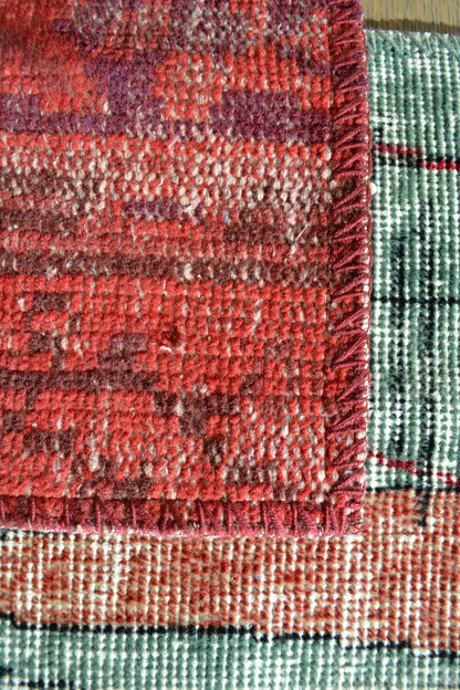 Handmade table runner, vintage rug runner, multicolored tablescape, multicolored table runner, eclectic table runner, top view, red zoomed in