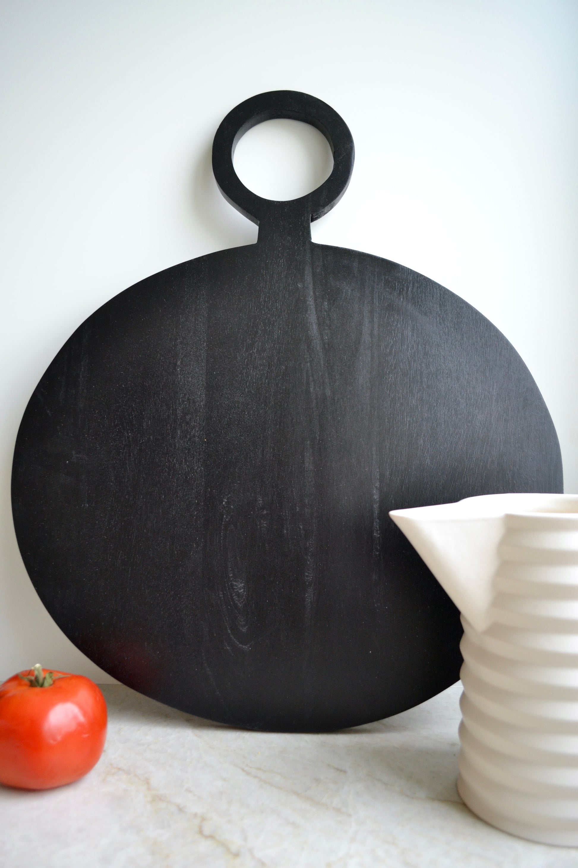 Charcuterie board, serving board, black cutting board, round black charcuterie board, black serving board, mango wood cutting board, home decor, zoomed out view