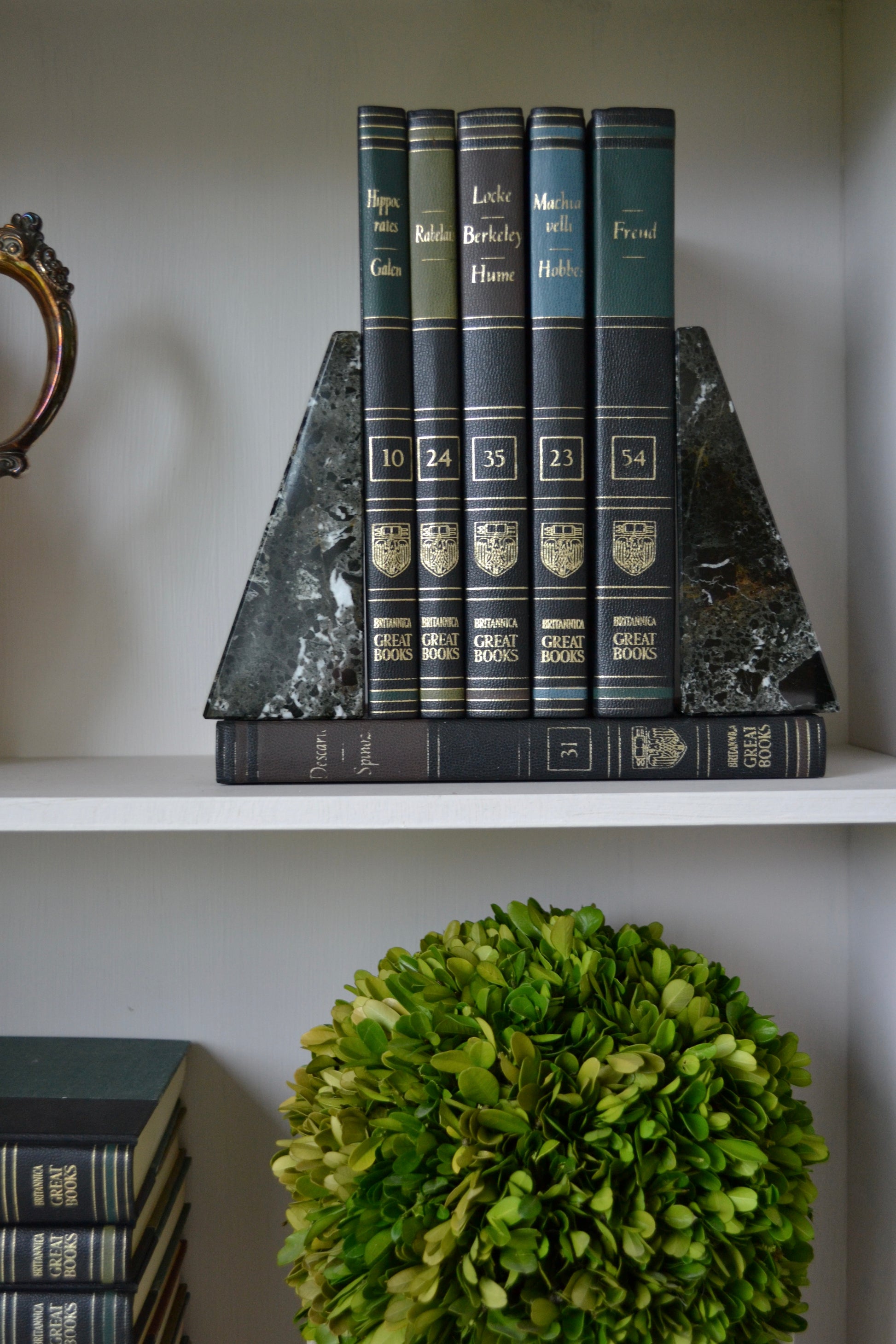 marble bookends, wedge shaped booked, neutral marble decor, black and white marble decor, shelf decoration, zoomed out view