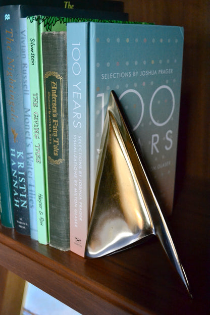 Bookend set, silver bookends, gold bookends, sculptural bookends, living room decor, eclectic home, unique decor, silver and gold decor, side view.