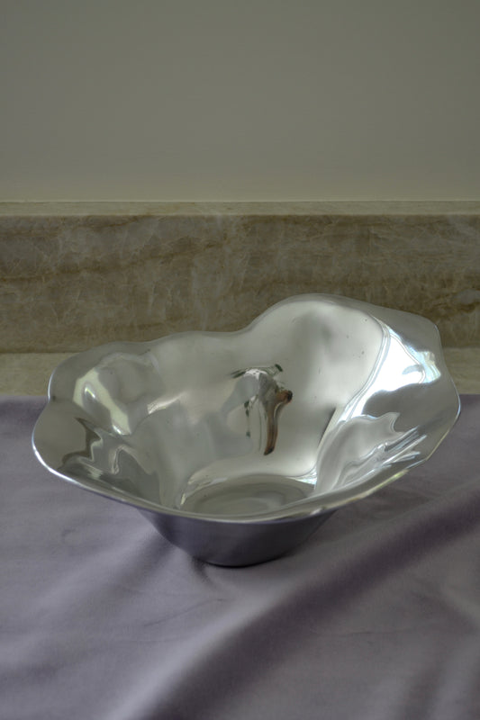 Silver bowl, freeform bowl, serving bowl, salad bowl, eclectic decor, kitchenware, kitchen bowl, funky home items, unique bowl, home decor, full view.