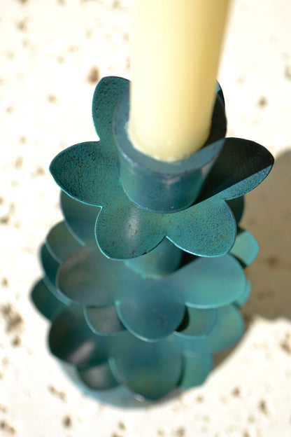 Metal candleholder, green candleholder, flower candleholder, coffee table decor, home accessories, teal decor, close up overhead view