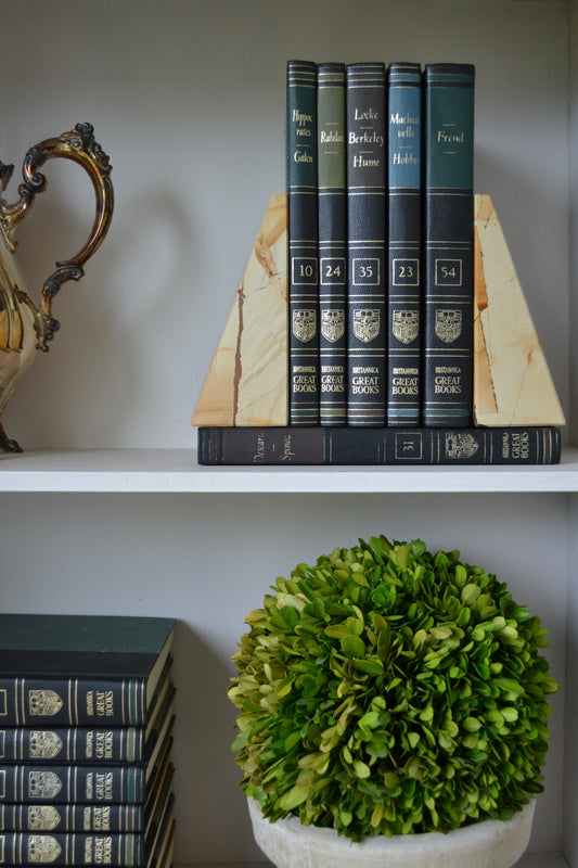 marble bookends, wedge shaped booked, neutral marble decor, black and white marble decor, shelf decoration, front view