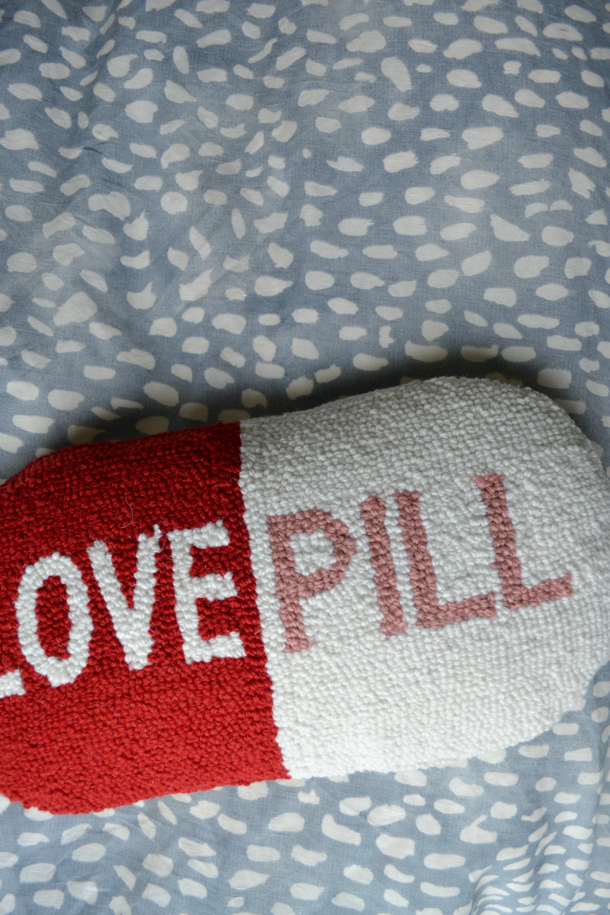 Wool pillow, hooked pillow, big deal pillow, throw pillow, pink red and white pillow, love pill pillow, living room, home decor, accents, zoomed in view