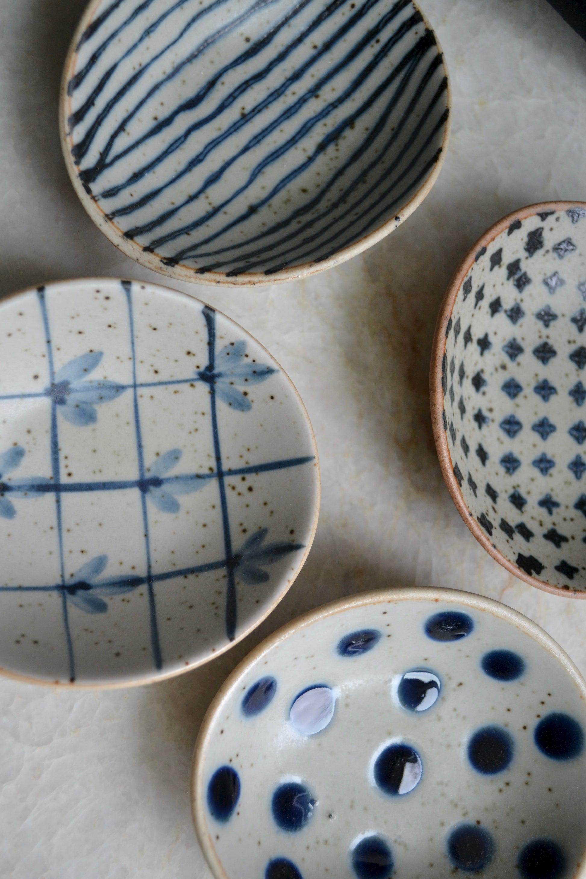 Small blue and white bowls, patterned dish set, bowl set, pinch bowls, stoneware, decorative kitchen decor, home accessories, top view on counter