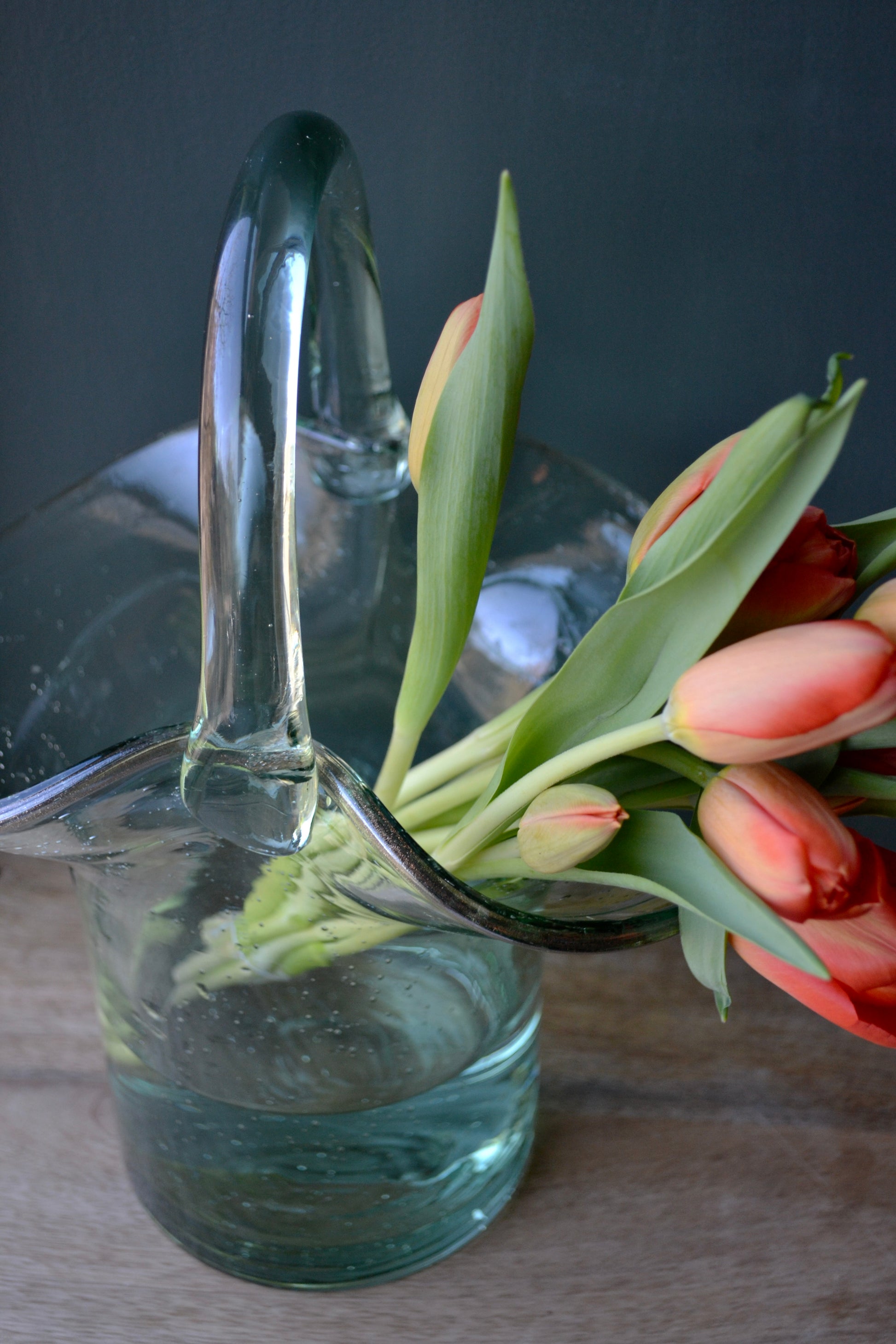 Purse vase, clear vase, purse flower vase, handbag vase, vase with handle, coffee table decor, handmade vase, glass vase, overhead view.