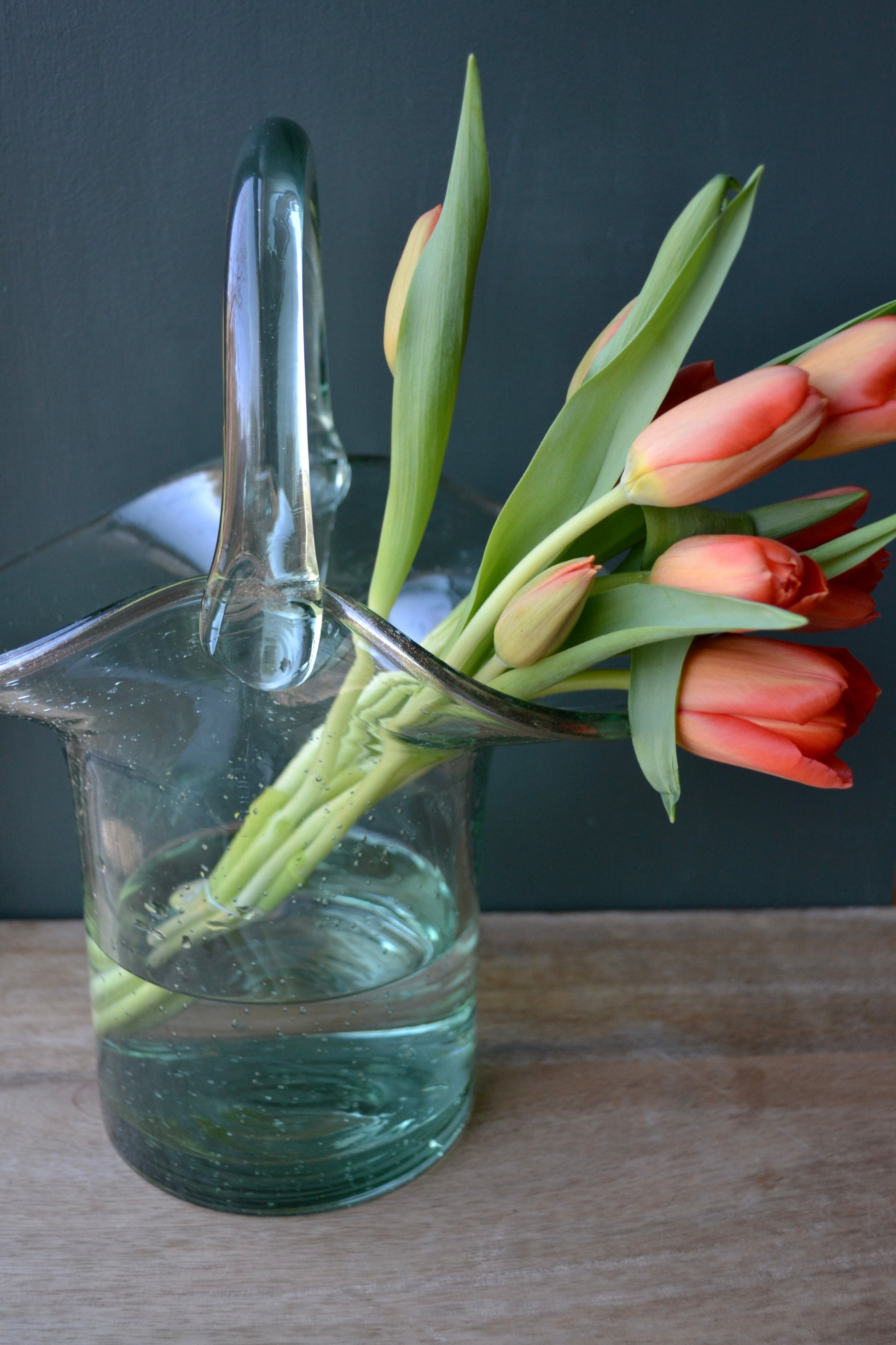 Purse vase, clear vase, purse flower vase, handbag vase, vase with handle, coffee table decor, handmade vase, glass vase, zoomed out view.