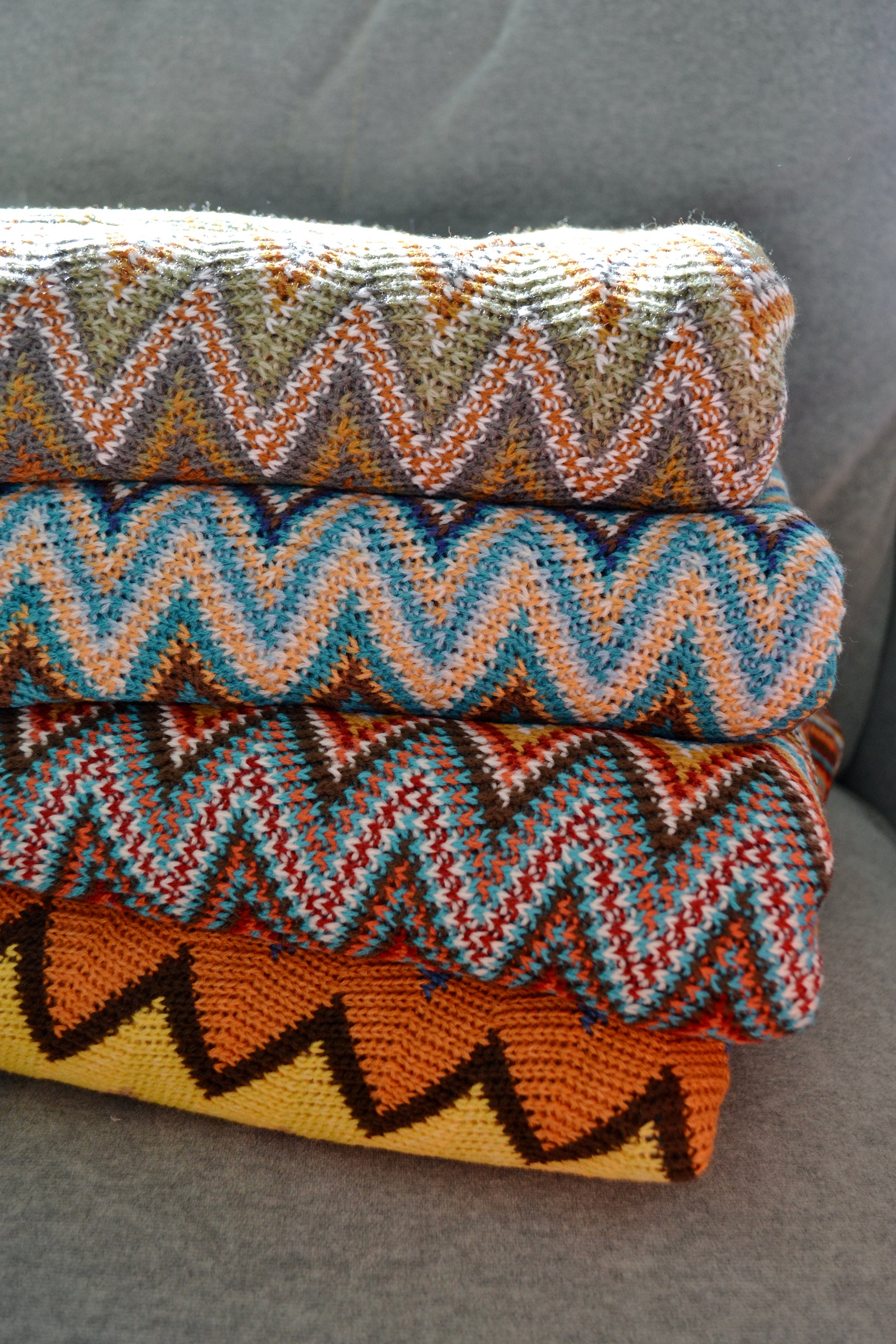 Colorful throw blanket, boho blanket, zig zag blanket, green blue red yellow orange brown blanket, throw blanket, home decor, blanket pile  view