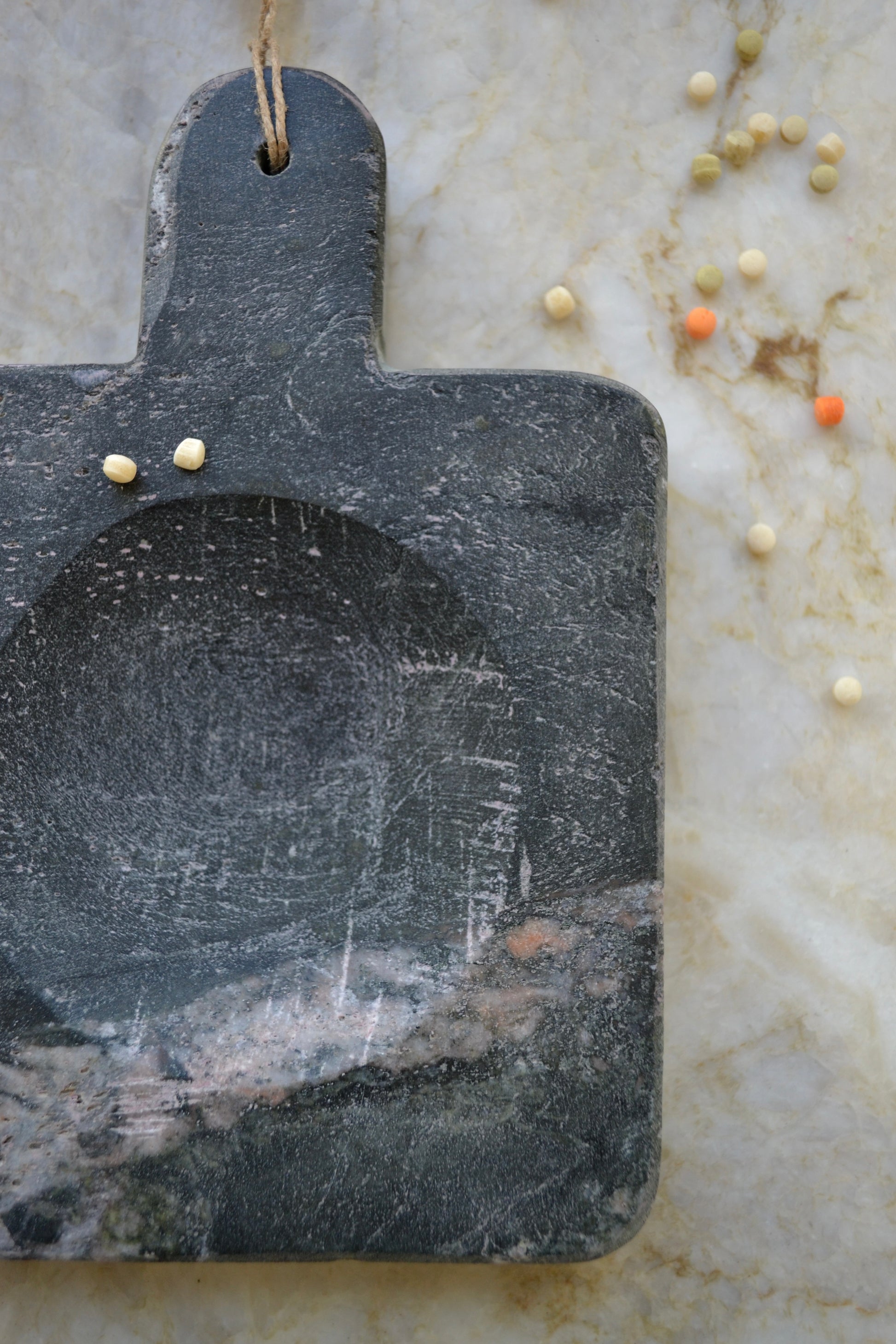 Stone spoon rest, black marble, jute tassel, marble kitchen home decor, overhead close up view