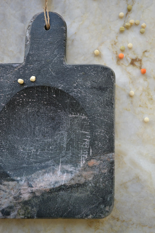 Stone spoon rest, black marble, jute tassel, marble kitchen home decor, overhead close up view